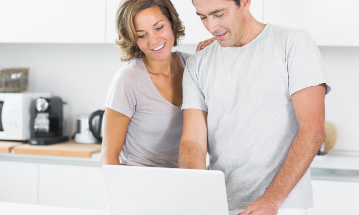 Couple discussing in front of Laptop 2