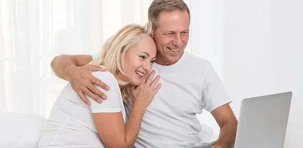 Couple is enjoying by watching Laptop 2